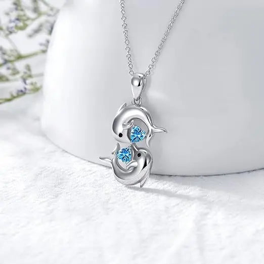 Collana in Argento con Doubles Delfini e Cristallo Blu