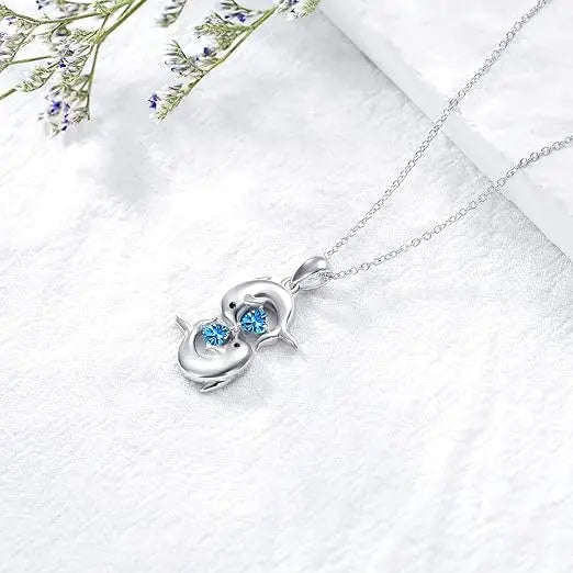 Collana in Argento con Doubles Delfini e Cristallo Blu